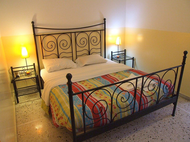 iron framed bed large comfortable room hostel athens