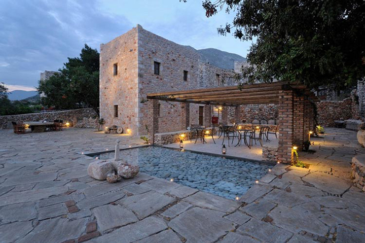 luxury hotel greece terrace with pond and dining area