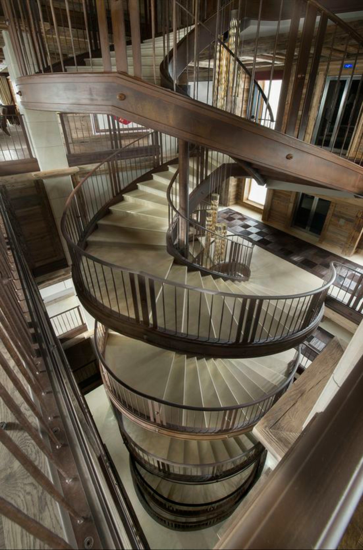 masterpiece wooden spiral indoor stairs luxury chalet in alps