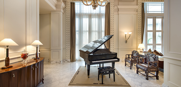 presidential suite living area with piano