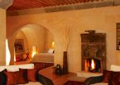 luxury rustic hotel room with fireplace