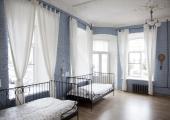 blue wall room 2 iron frame beds hostel st petersburg