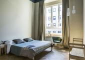 minimalistic furnished room chic hostel milan