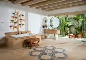 vast luxury villa's bathroom with tub and zen garden view