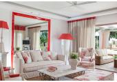 nice red stylish living room part of luxury villa for rental in corfu, greece