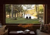 lake view through the window of luxury cottage