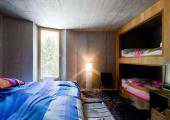 king size and bunk beds at villa vals in swiss alps