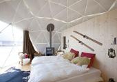 Book Accommodation in this Cozy Rustic Style Tent at White Pod Swiss Alps Resort