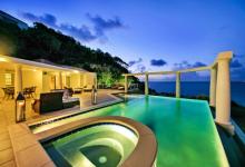 villa's outdoor pool by night