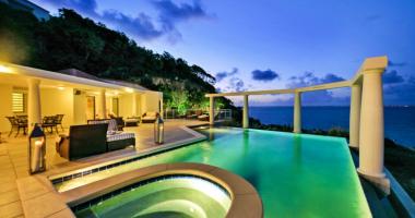 villa's outdoor pool by night